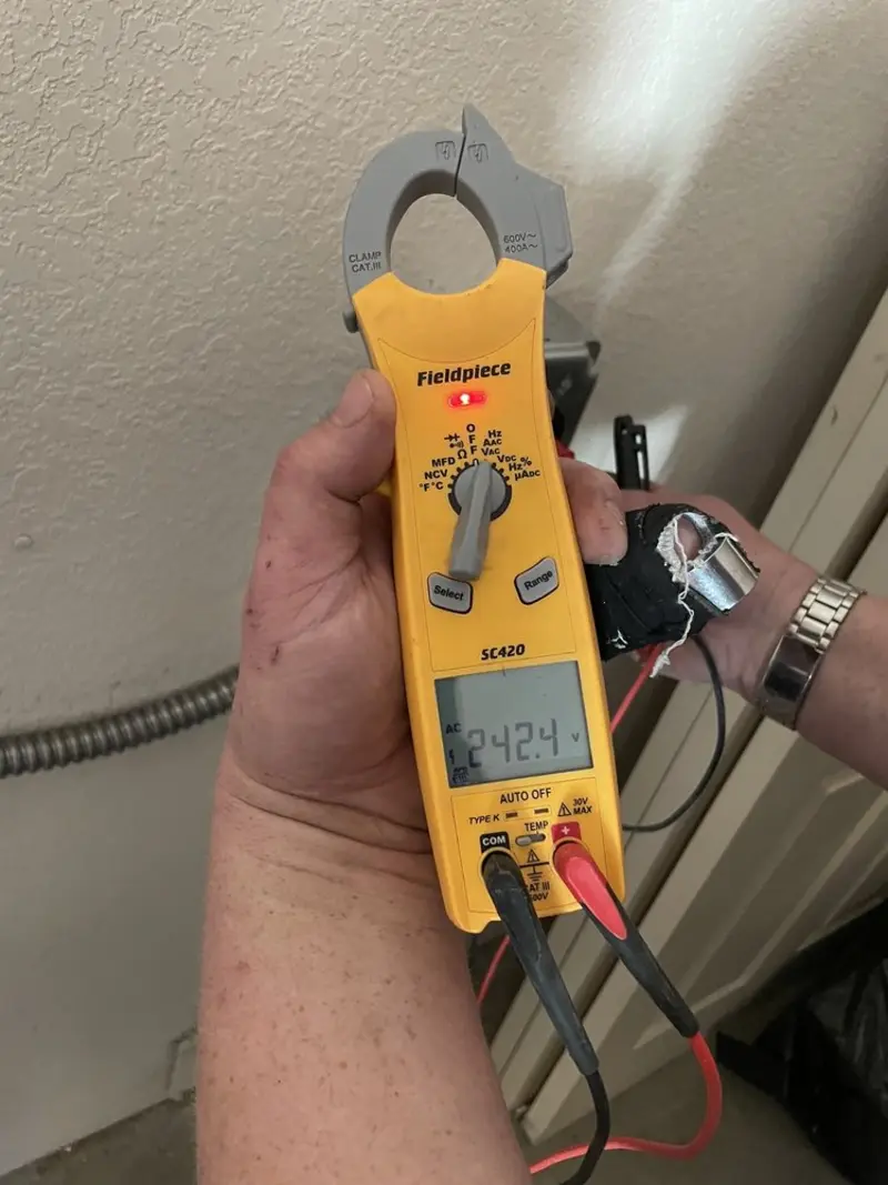 Voltage testing with clamp meter during Generator Installation in North Ogden